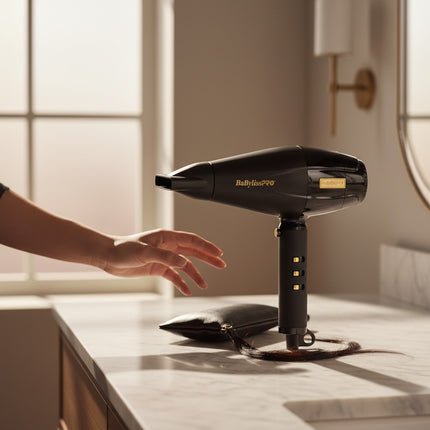 Tia's Treasure Collections BaByliss 4Barber Influencer Edition black professional hair dryer on a marble counter.
