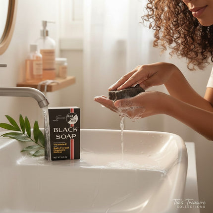 Tia's Treasure Collections Black & White soap bar being lathered under running water in a bright bathroom sink.