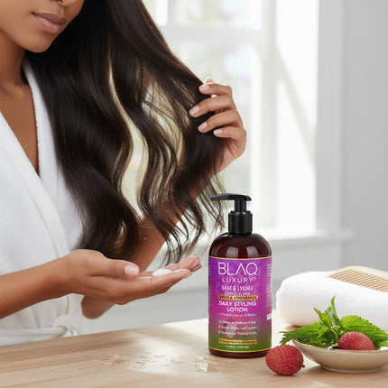 Tia's Treasure Collections Blaq Luxury Sage and Lychee daily styling lotion bottle with pump dispenser on a table.