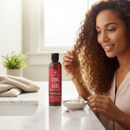 Tia's Treasure Collections As I Am Long and Luxe GroYogurt leave-in conditioner bottle on a bathroom counter