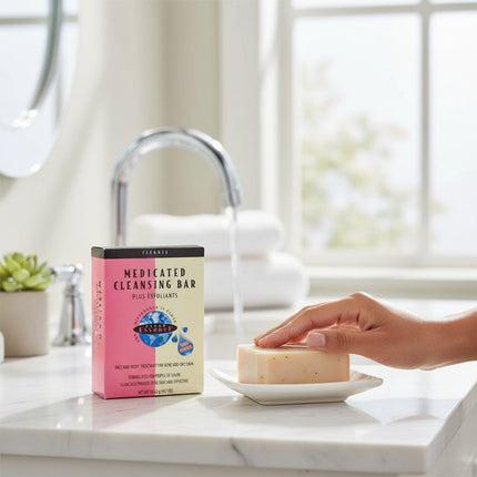 Tia's Treasure Collections Clear Essence medicated exfoliating cleansing bar on a soap dish in a bright bathroom.