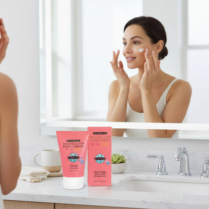 Tia's Treasure Collections Clear Essence Medicated Fade Creme with SPF 15 for dark spots on a bathroom counter.