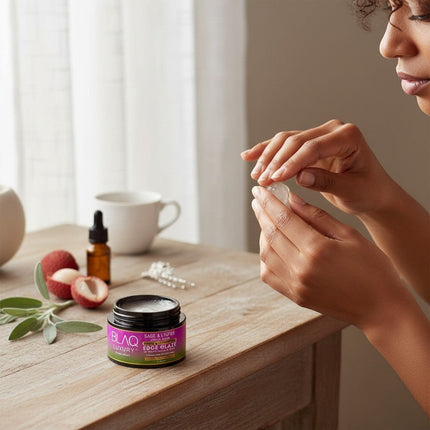 Tia's Treasure Collections Blaq Luxury Sage & Lychee edge glaze jar on a wooden table with fresh lychee and sage.
