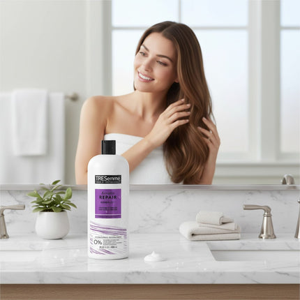 Tia's Treasure Collections Tresemme Keratin Repair Bond Plex Conditioner bottle on a bathroom vanity with a woman